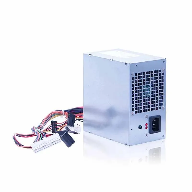 Rectangular ATX power supply unit, matte black metal casing, cooling fan visible on one side, cable bundle emerging from rear