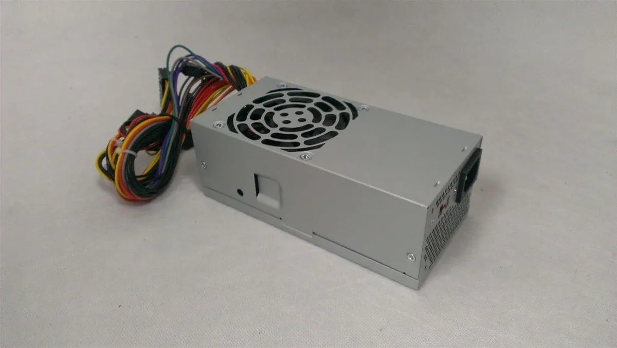 Compact TFX power supply unit, matte metal casing, 80mm fan visible