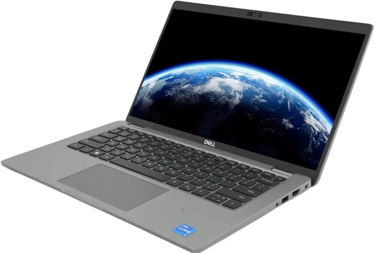 Silver 14-inch Dell Latitude 5440 laptop, open showing keyboard and screen, minor marks on lid