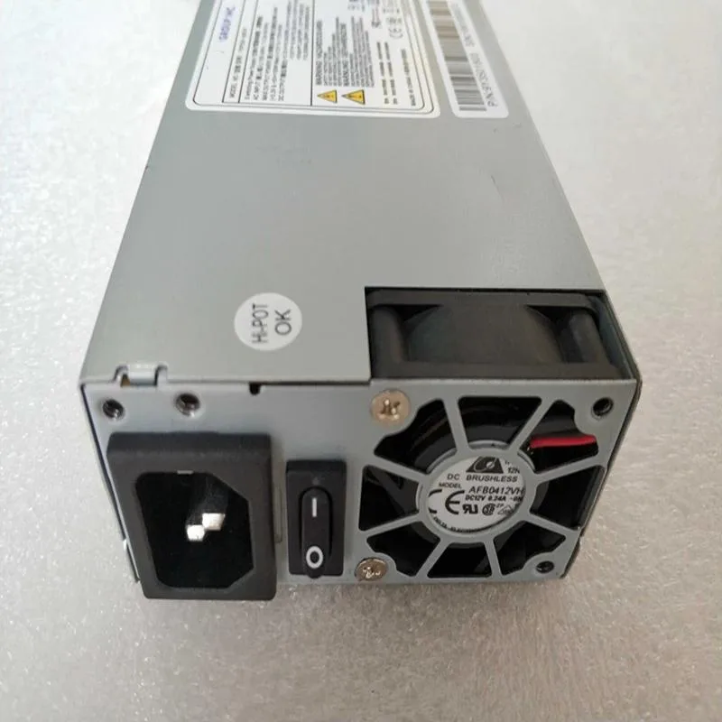 Rectangular metal 1U PSU with fan grille and cable bundle