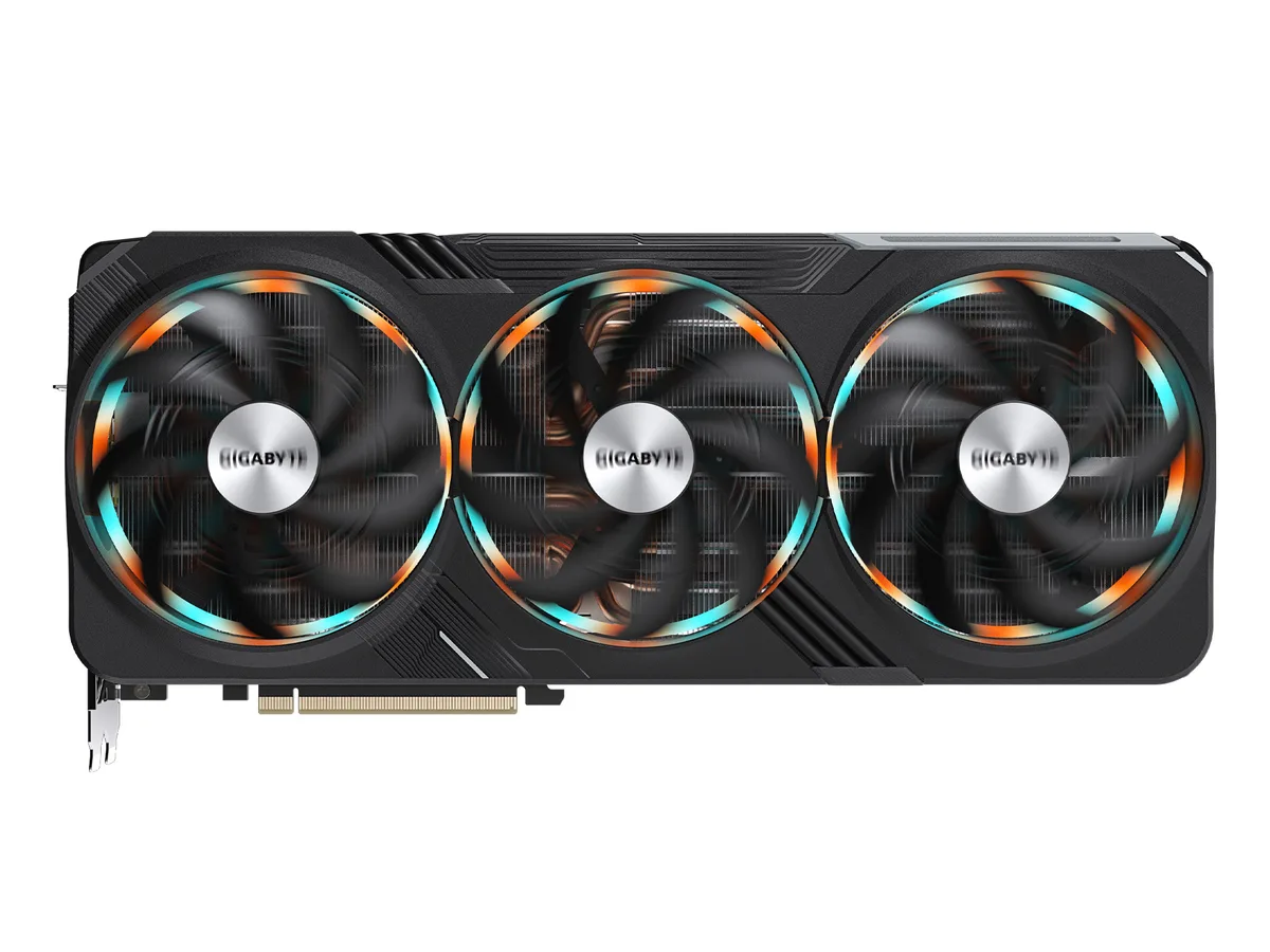 Large triple-fan graphics card, dark metal shroud, exposed heatsink fins, backplate visible