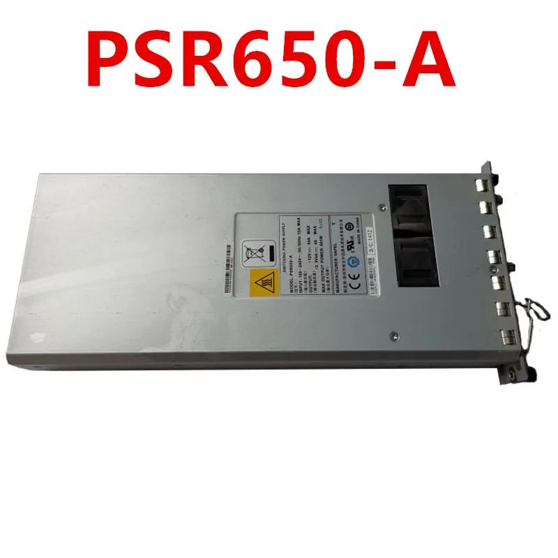 Rectangular silver metal power supply unit with ventilation grille and label showing model numbers