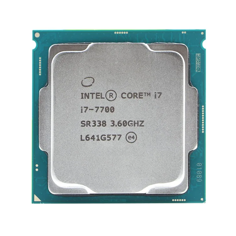 A bare Intel Core i7-7700 desktop processor in a green ceramic package with gold contact pads on the underside