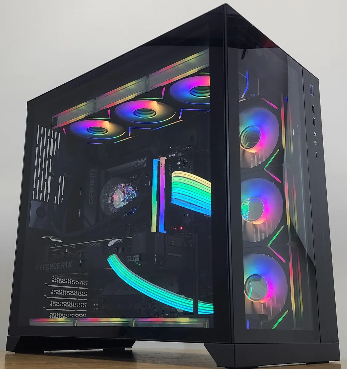 Black Lian Li O11 Dynamic case with 360mm AIO RGB cooler and RTX 4070 graphics card visible through tempered glass side panel
