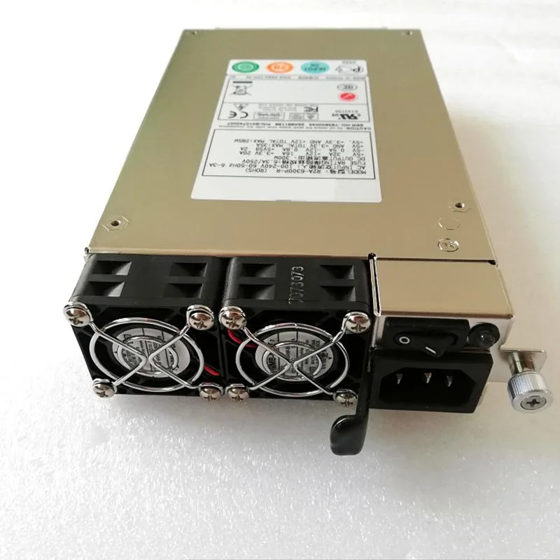 Rectangular metal ATX power supply unit with ventilation grille and cable bundle