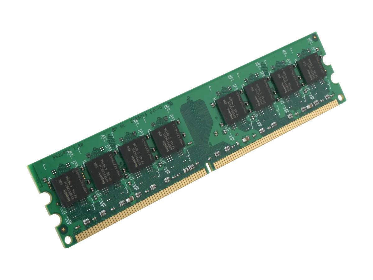 Green circuit board with black memory chips and gold edge connector