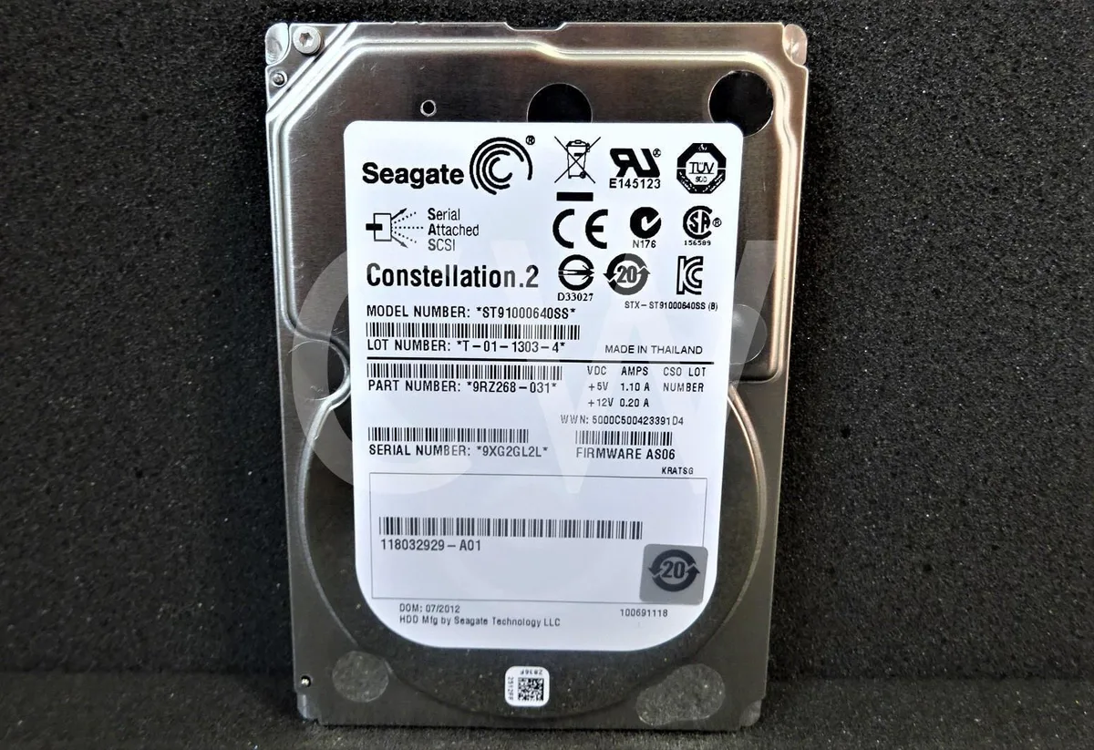 Silver 2.5 inch SAS hard drive with green circuit board visible on underside
