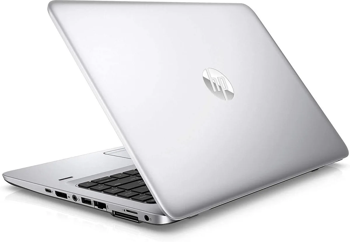 Silver 14 inch HP EliteBook 840 G4 laptop with visible wear marks on the lid