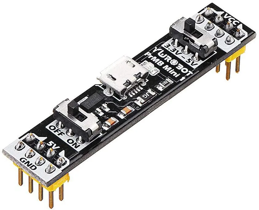 Small rectangular green PCB module with pin headers and a slide switch, 53 by 11 mm