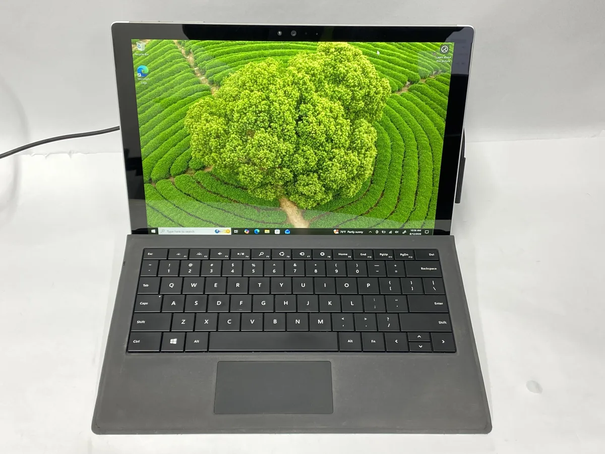 Silver HP Surface Pro 4 12 inch tablet with kickstand and keyboard cover attached