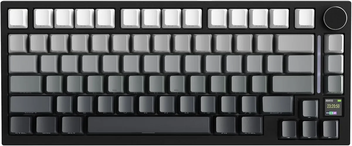 Dark compact keyboard with a small screen and metal knob on the right side