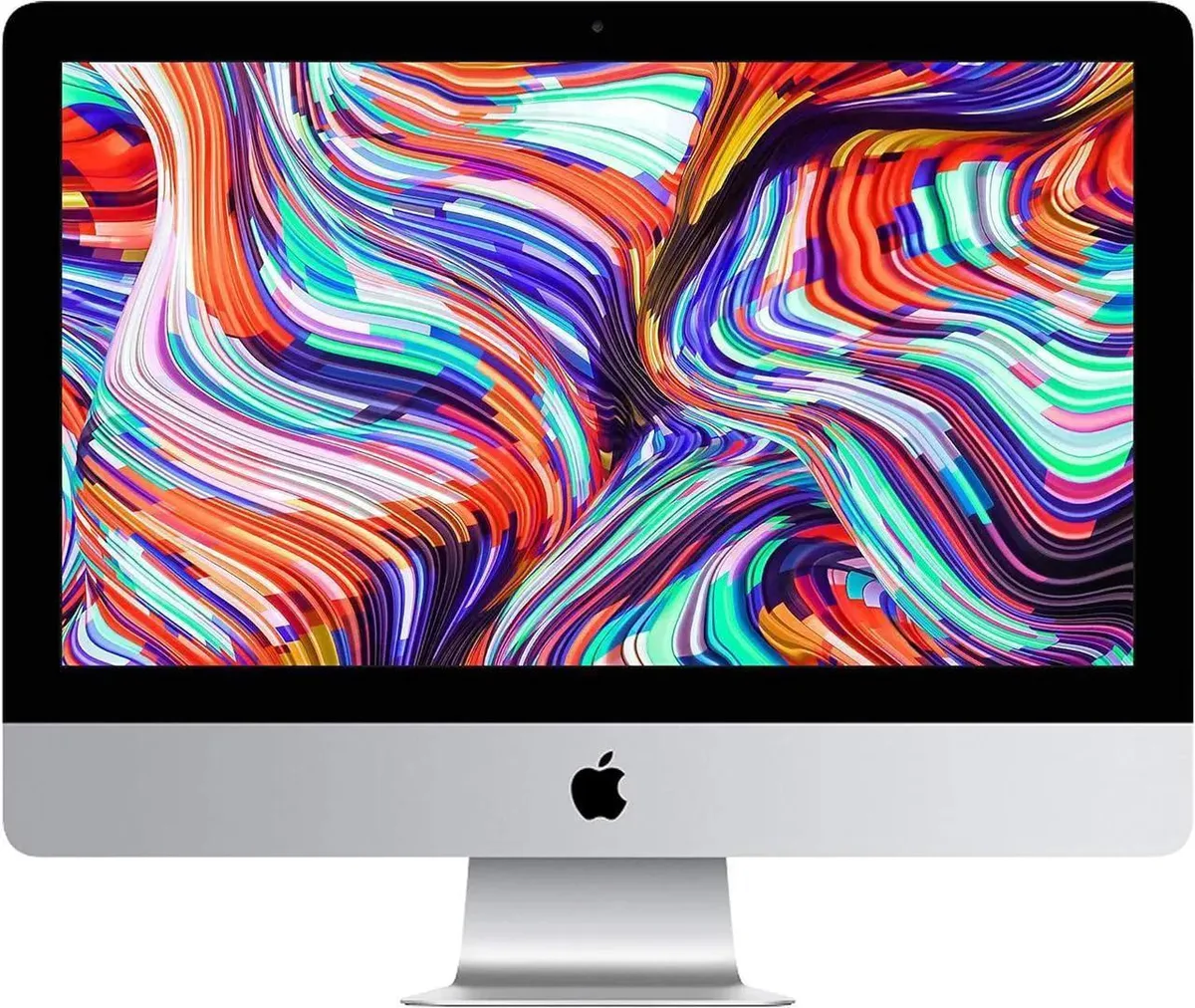 Silver all-in-one desktop with thin bezel display and visible dents scratches on aluminium edges and stand