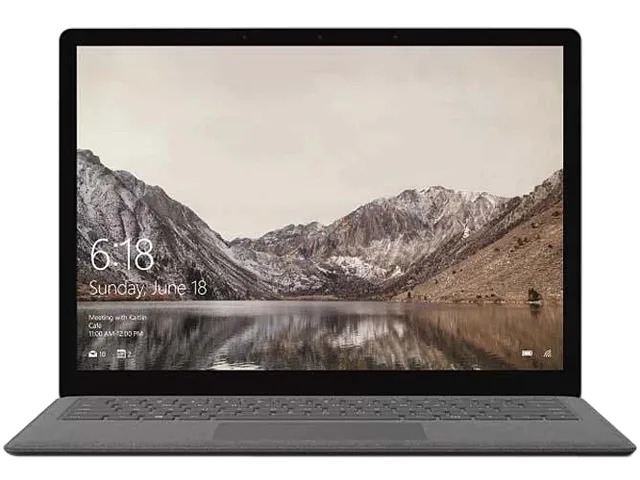 A 13.5-inch Graphite Gold aluminium laptop with a fabric keyboard deck, shown closed