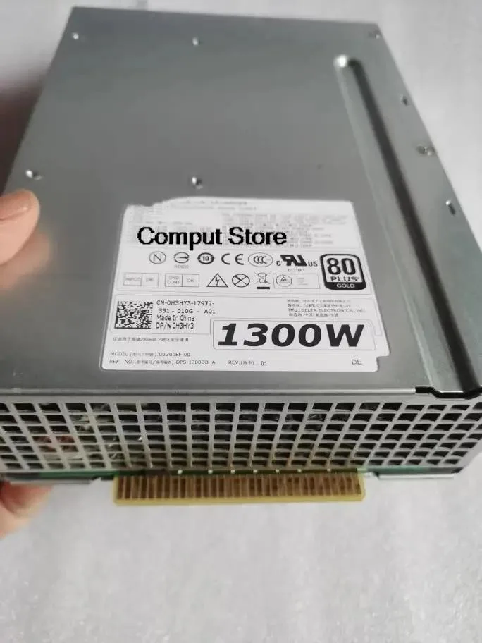 Rectangular silver ATX power supply unit with fan grille and cable connectors