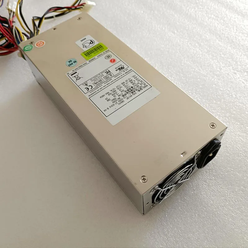 Silver metal rectangular 2U power supply unit with ventilation grille and model labels P2G-6510P P2G-6460P