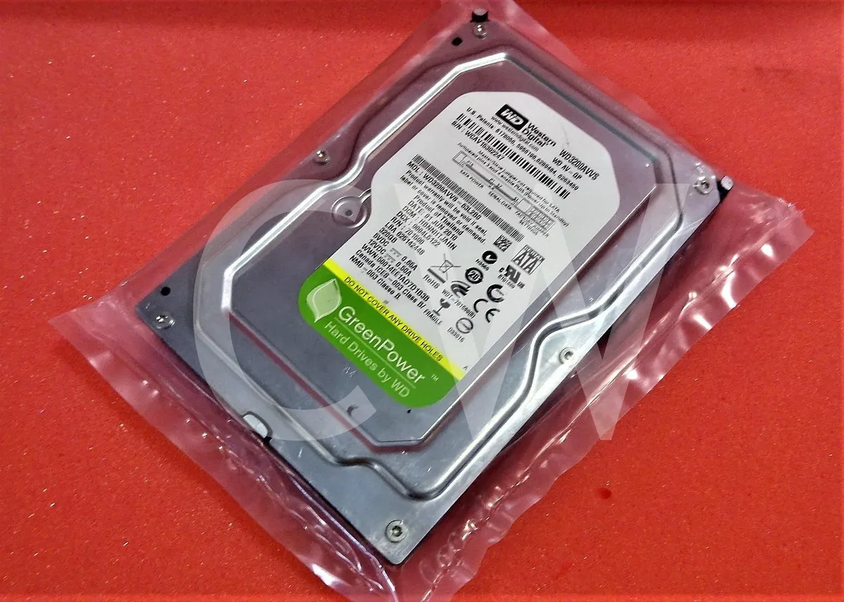 Silver 3.5 inch SATA hard drive with green circuit board visible