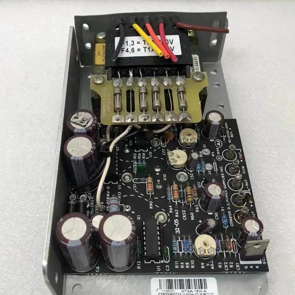 Small black enclosed power supply module with label showing voltage ratings