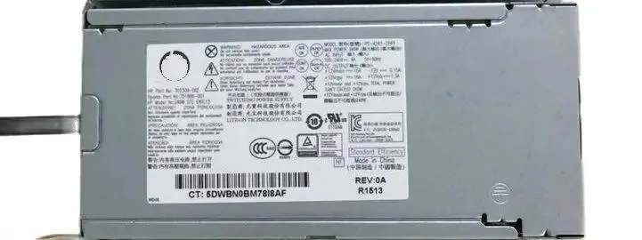 Rectangular metal ATX power supply unit with ventilation grille and label