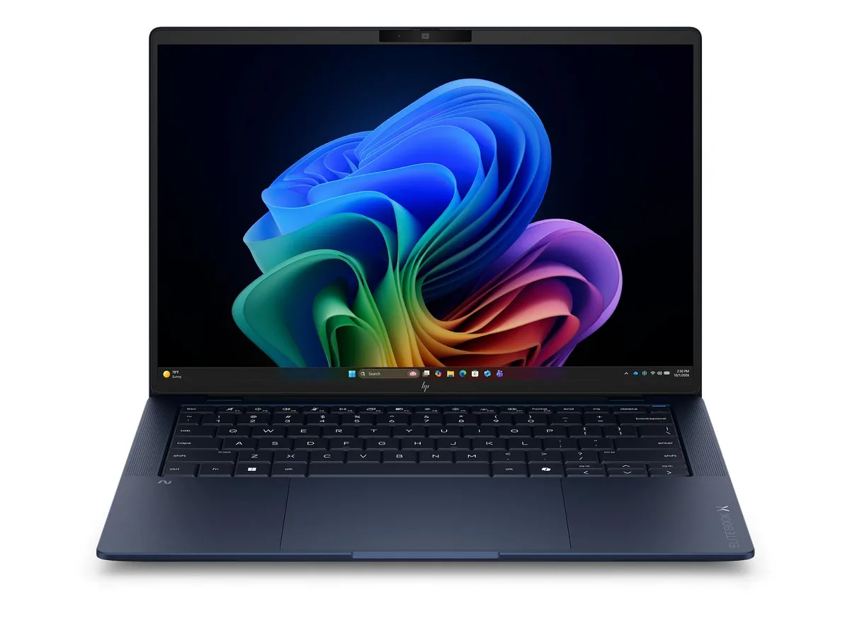 Silver 14-inch business laptop, thin tapered profile, matte finish, closed lid showing HP logo