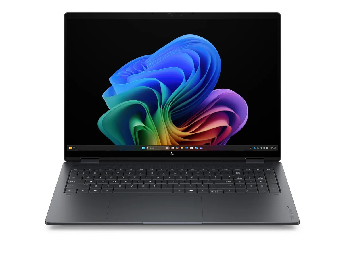 Silver 16-inch 2-in-1 laptop with edge-to-edge glass display, flat keyboard deck