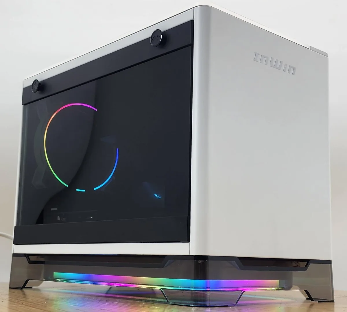 White InWin A1 Prime ITX case with glass side panel showing internal components