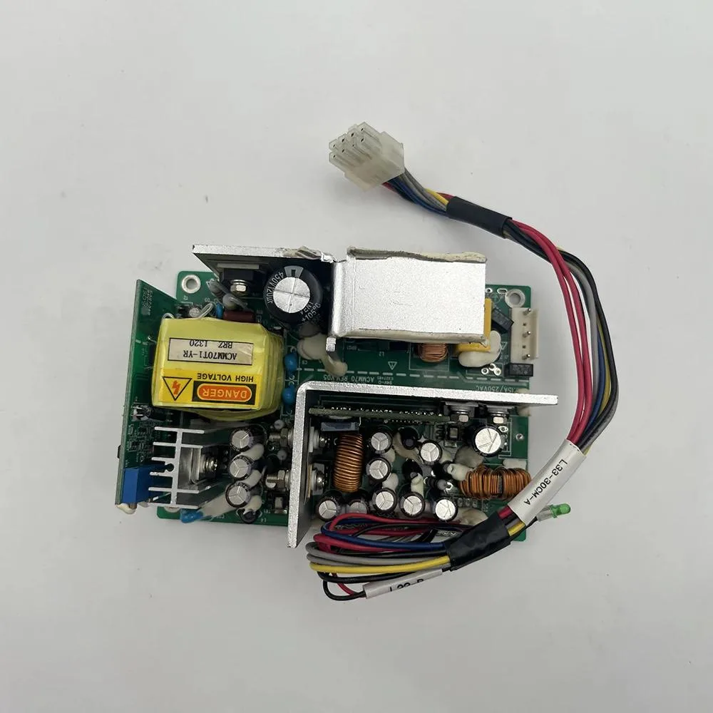 Rectangular silver metal ATX power supply unit with ventilation slots and output terminals