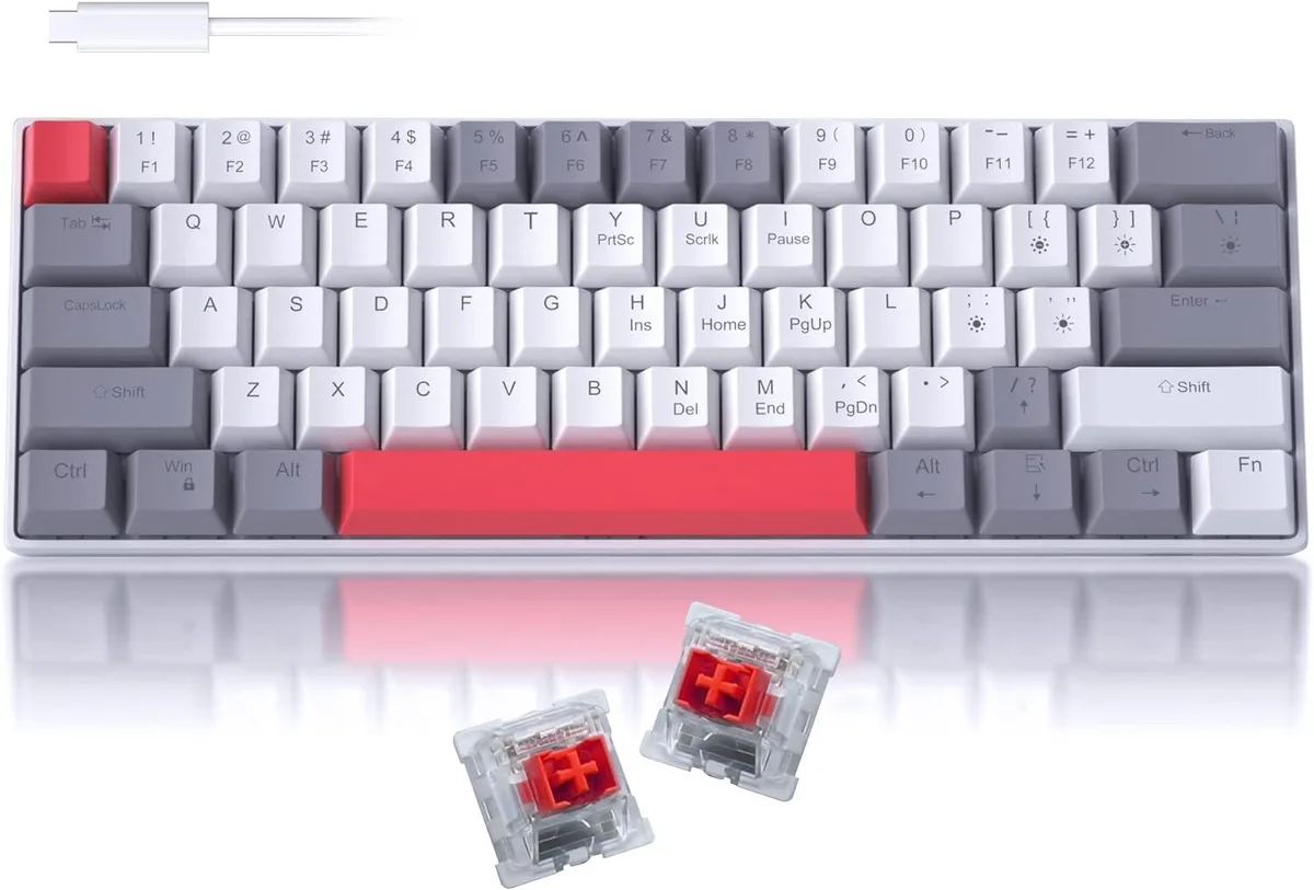 Compact 60 percent mechanical keyboard with mixed colour keycaps and blue LED lighting