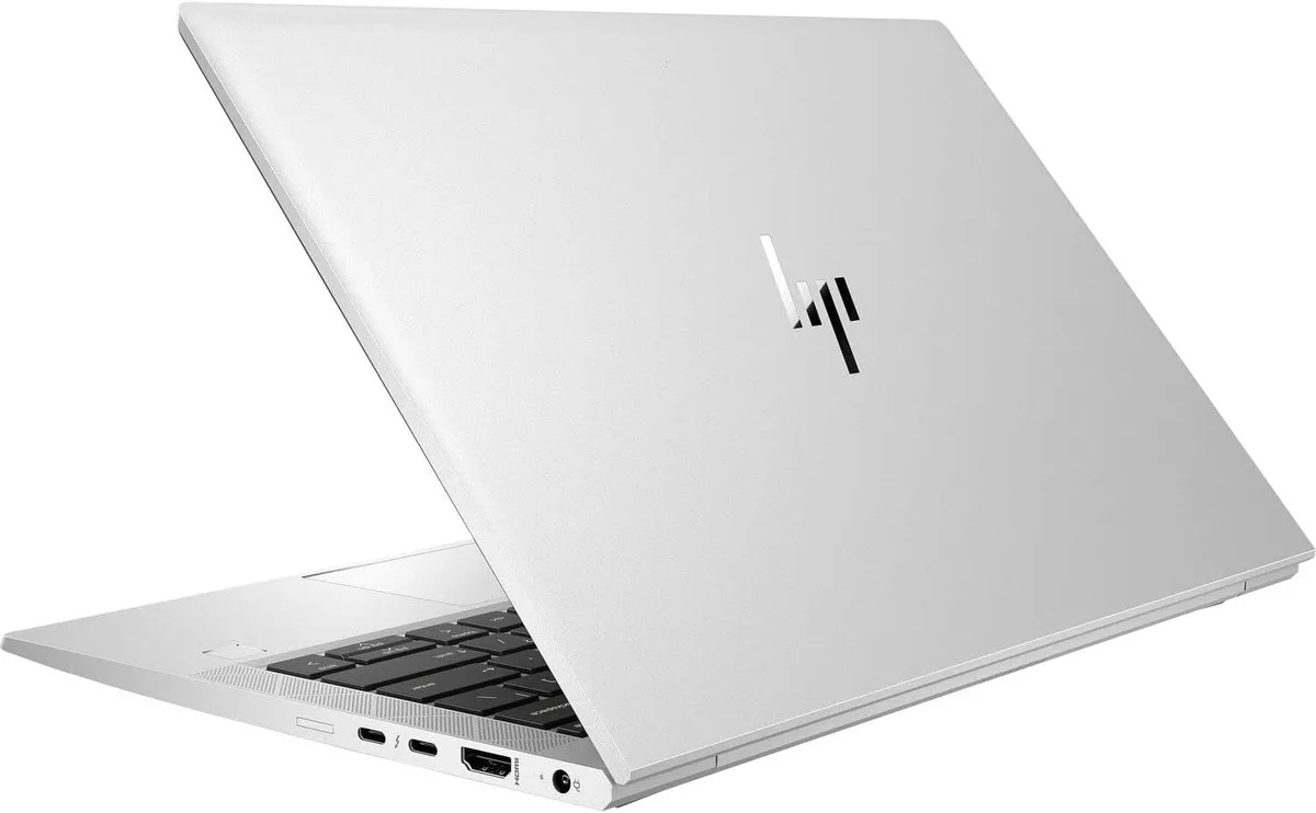 Silver 14-inch HP EliteBook 840 G8 laptop with touchscreen showing scratches and dents on the metal case