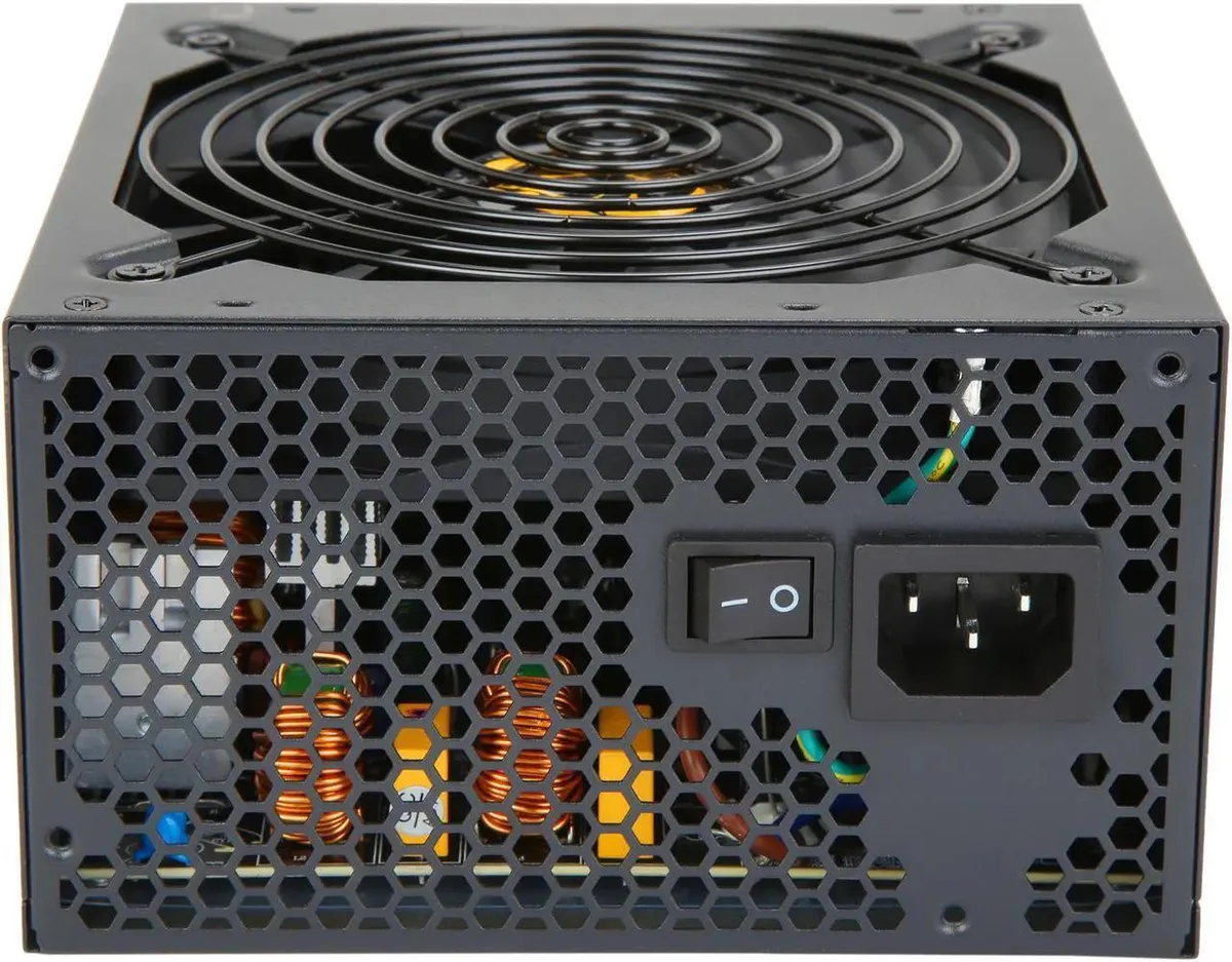 Black rectangular ATX power supply unit with fan grille and power socket