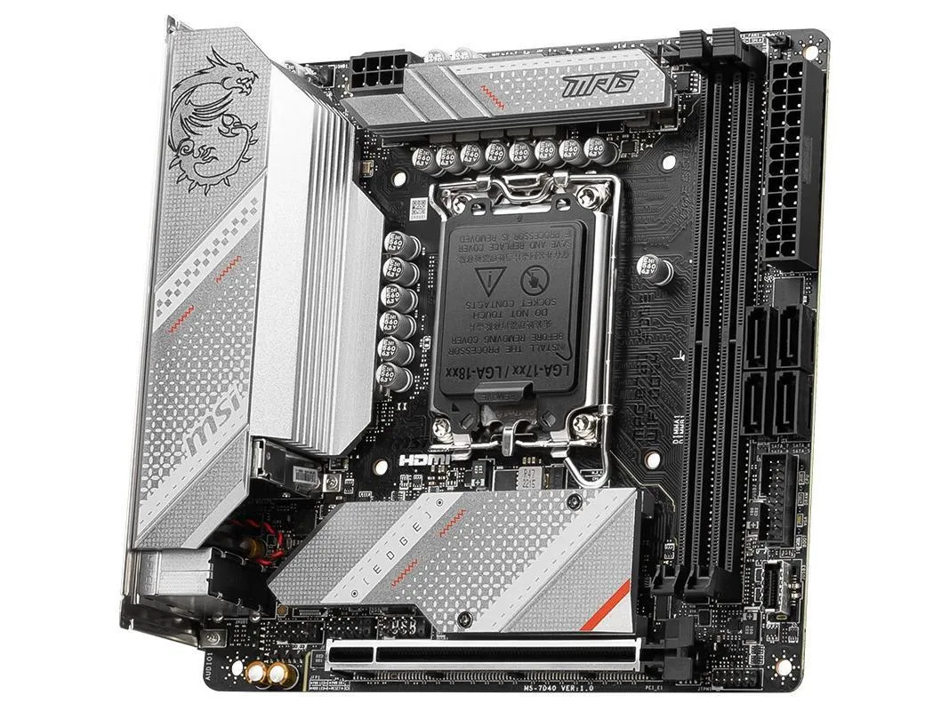 Compact Mini-ITX board, dark PCB, silver heatsinks, rear I/O shield