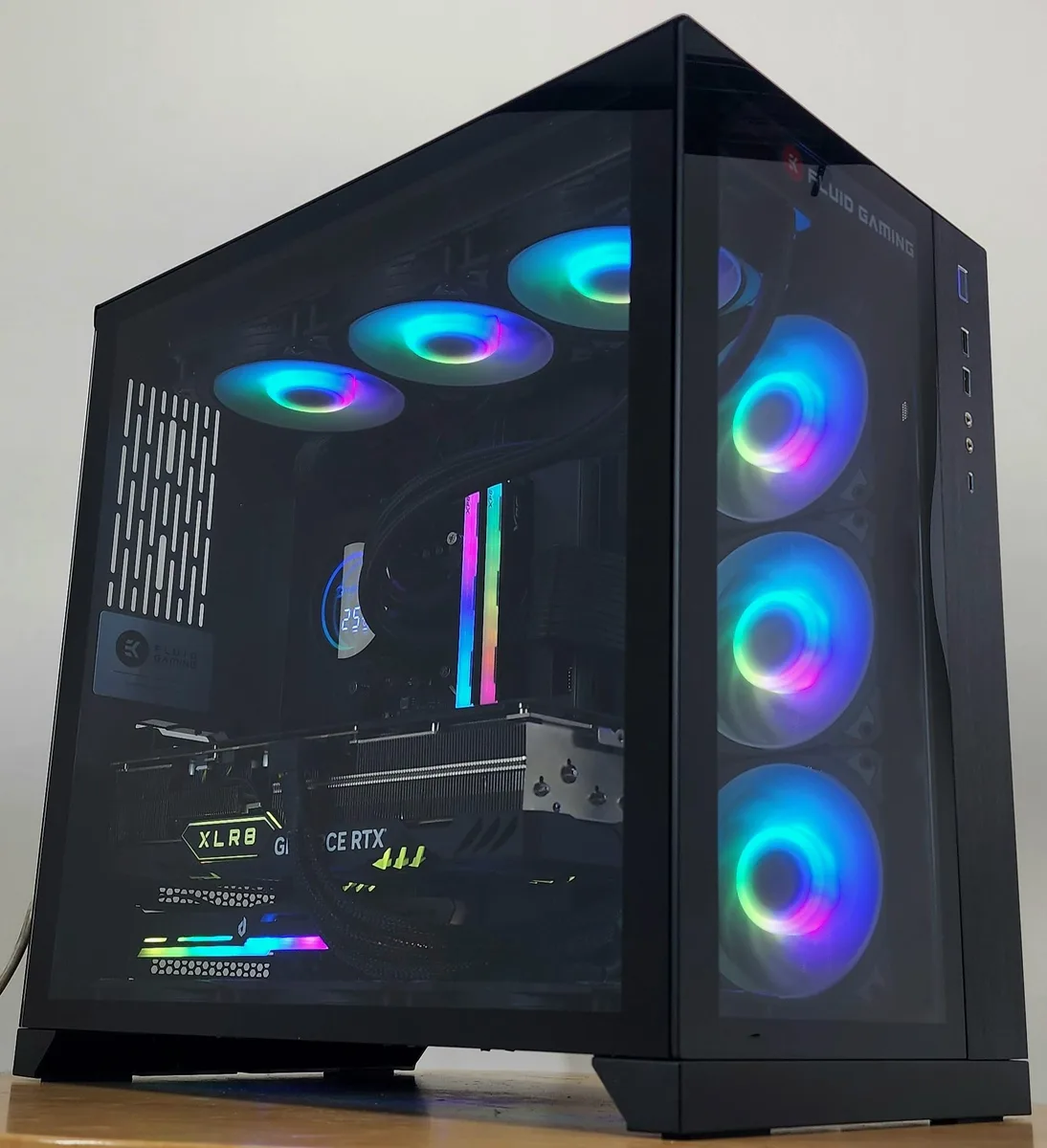 Black Lian Li O11 Dynamic case with 360mm AIO LCD cooler and RTX 4080 graphics card visible inside
