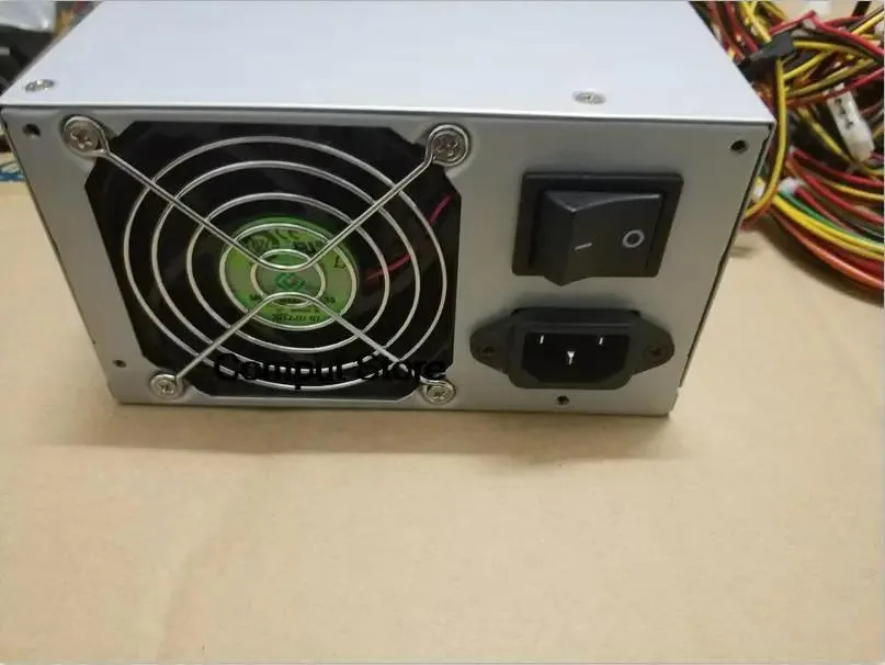 Rectangular silver ATX power supply unit with ventilation grille