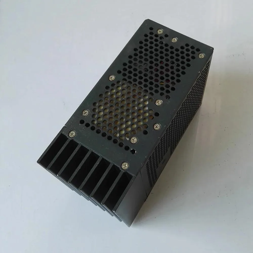 Rectangular metal power supply unit with ventilation slots