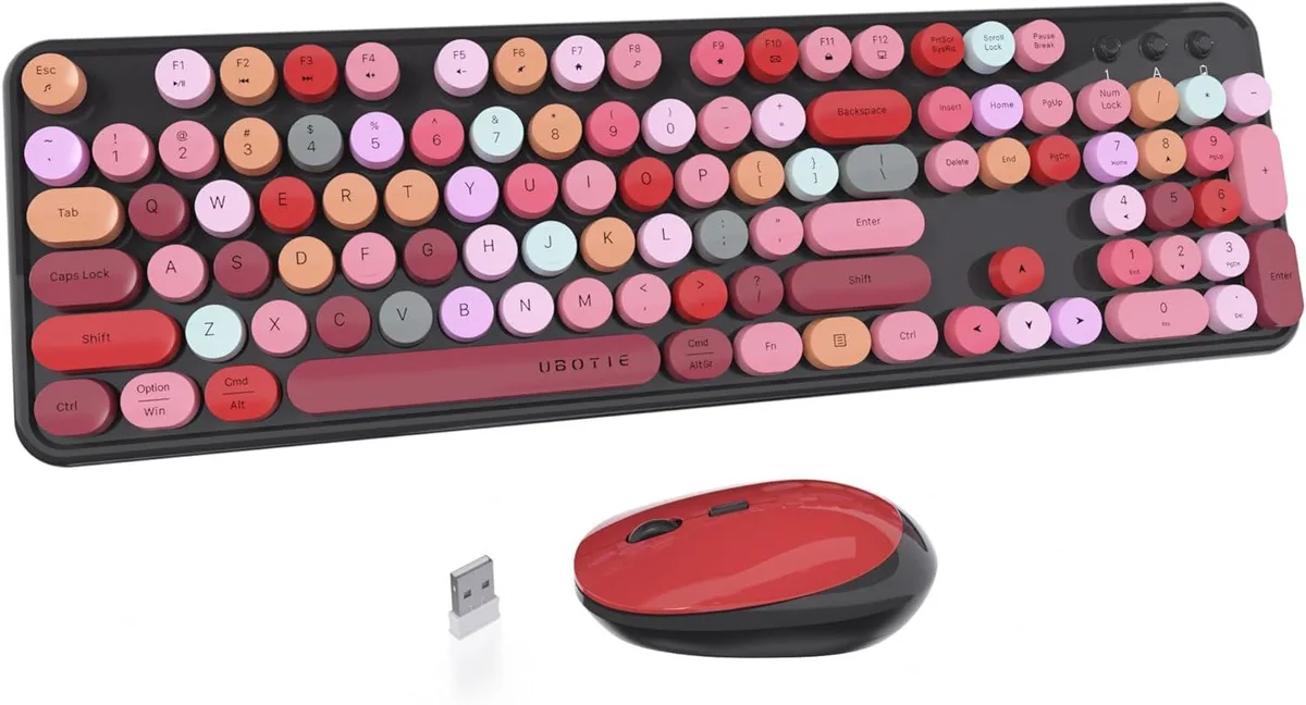 Black full-size wireless keyboard with multicolor round keycaps and mirror finish, plus matching optical mouse