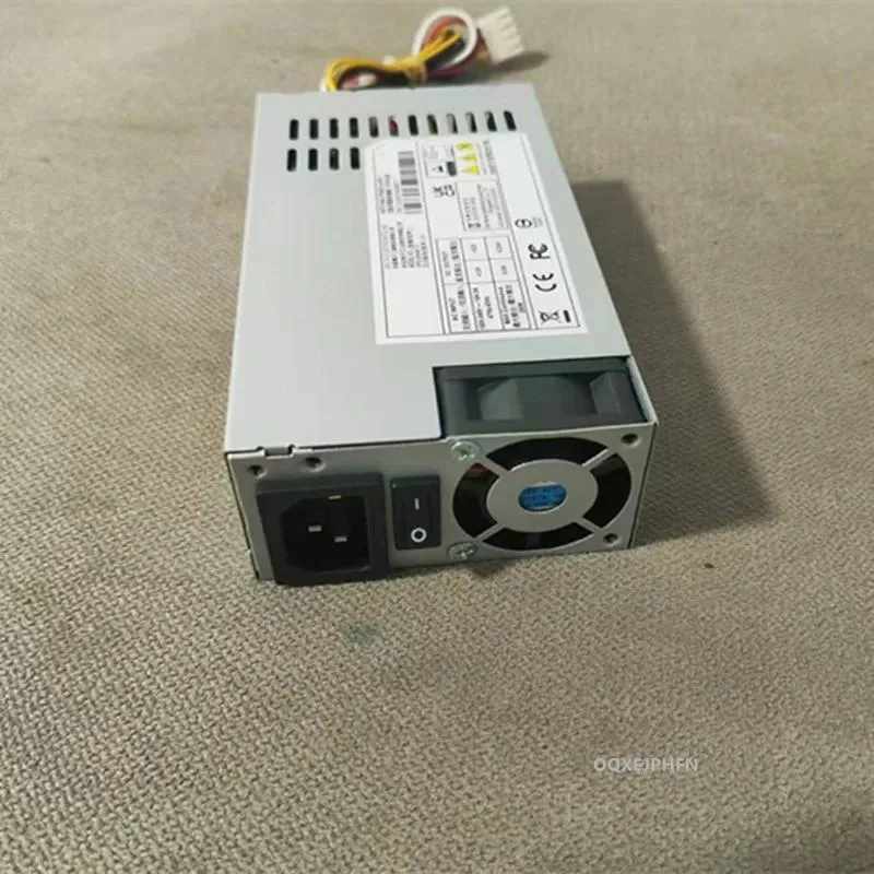 Silver rectangular ATX power supply unit with cooling fan visible