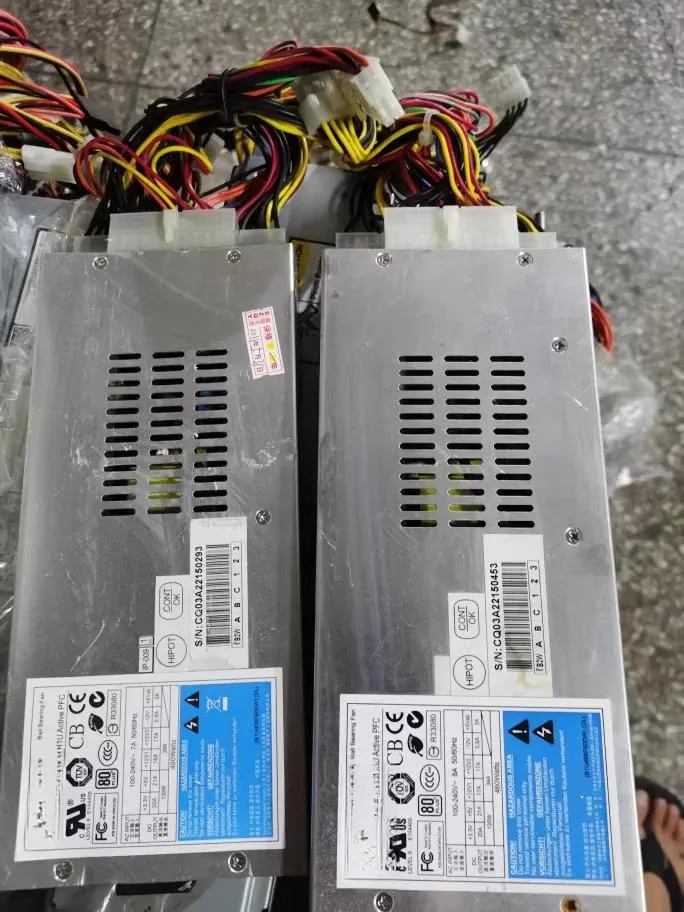 Compact 1U server PSU, matte metal casing, rear fan grille and IEC socket
