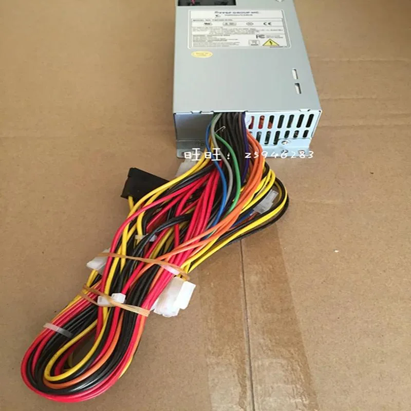 Compact 1U silver power supply unit with rear fan grille and DC input label