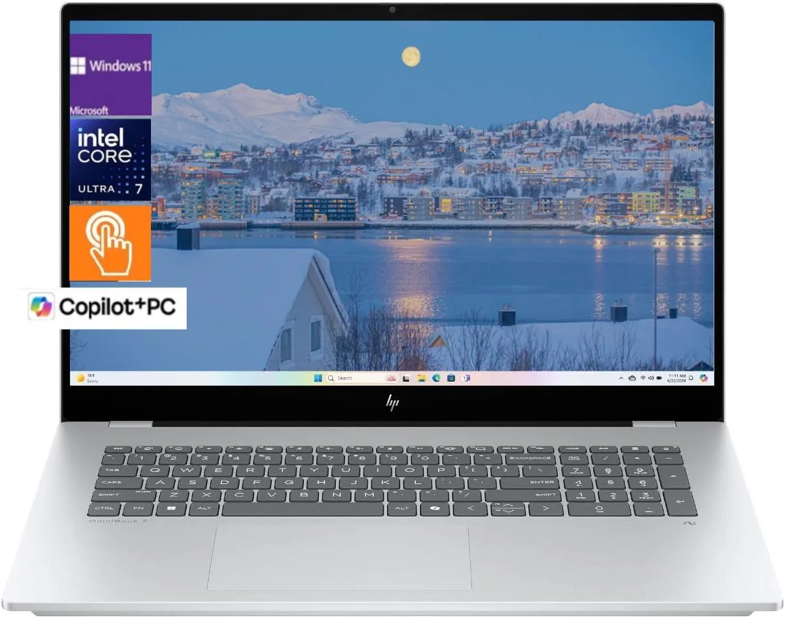 Silver 16-inch laptop with edge-to-edge glass OLED touchscreen and backlit keyboard