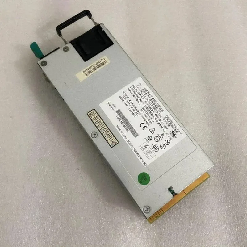 Rectangular silver metal server power supply unit with rear ventilation grille and label showing model DPS-700LB C 750W