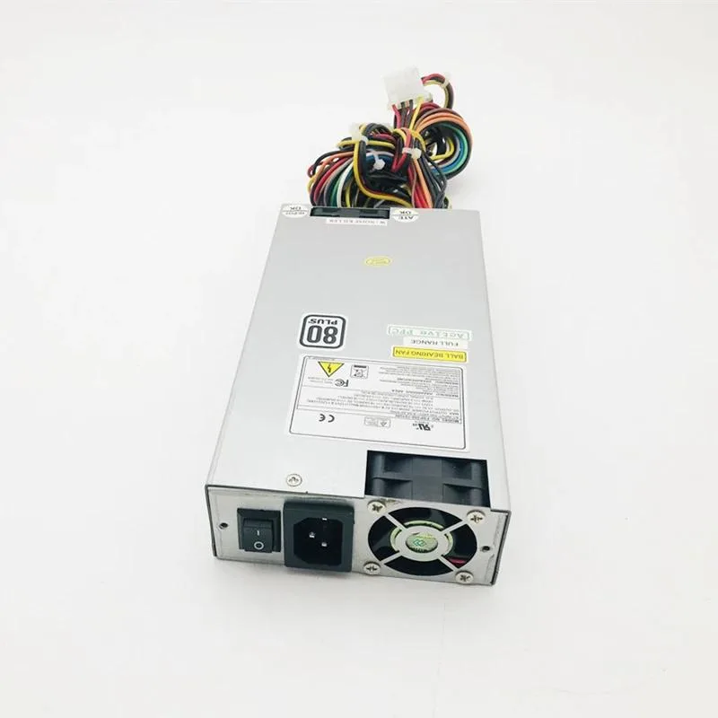 Compact silver 1U ATX power supply unit with rear fan grille and cable bundle