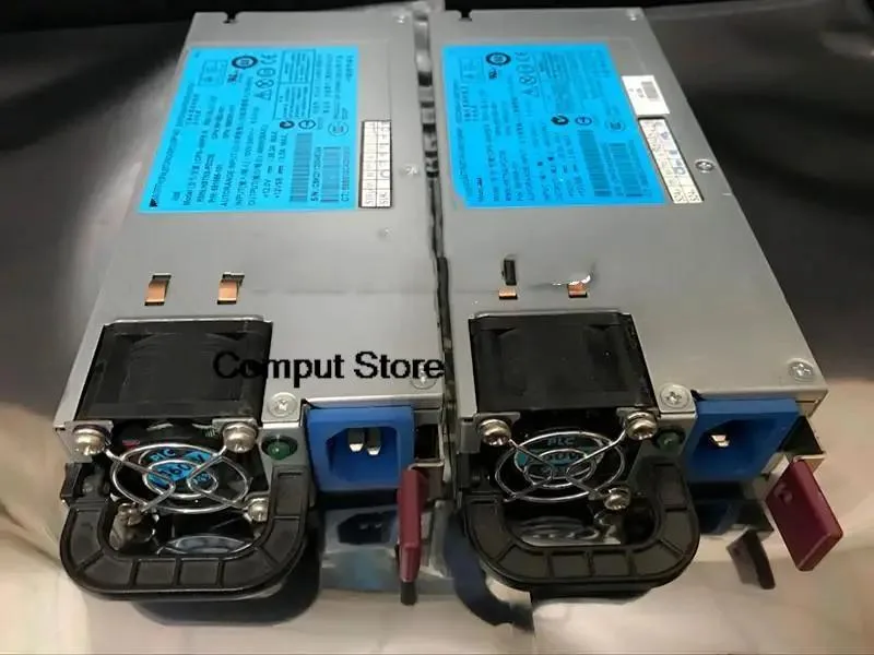 Rectangular silver server power supply unit with rear fan grille and power socket
