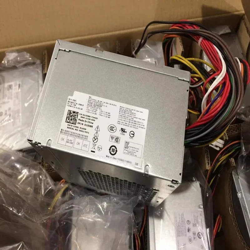 Rectangular black ATX power supply unit with fan grille and cable bundle