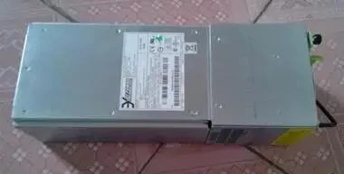 Rectangular metal ATX power supply unit with ventilation grille and label sticker