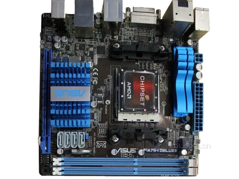 Compact green Mini-ITX motherboard with black heatsinks and rear I/O shield