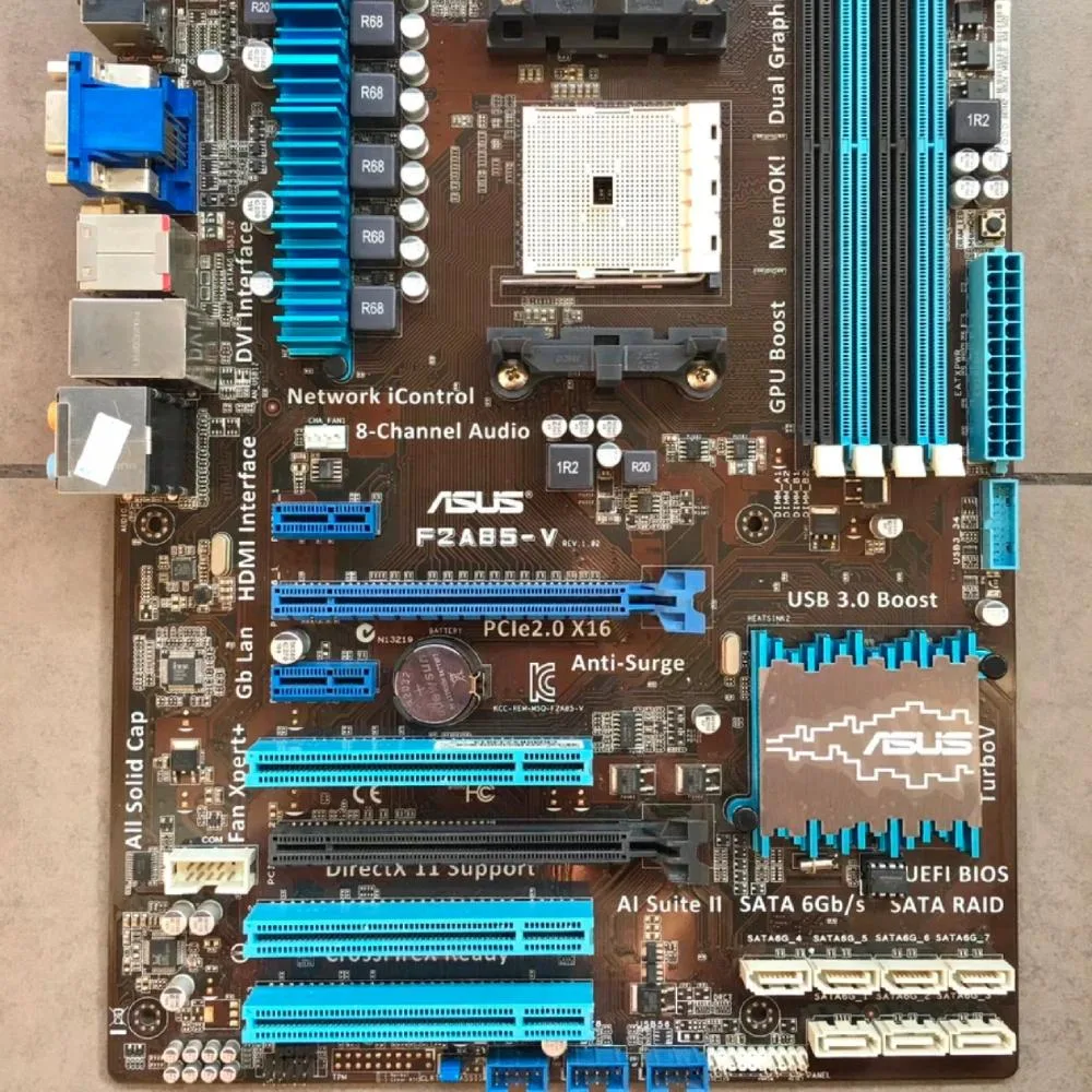Green ATX motherboard with silver heatsinks and black expansion slots