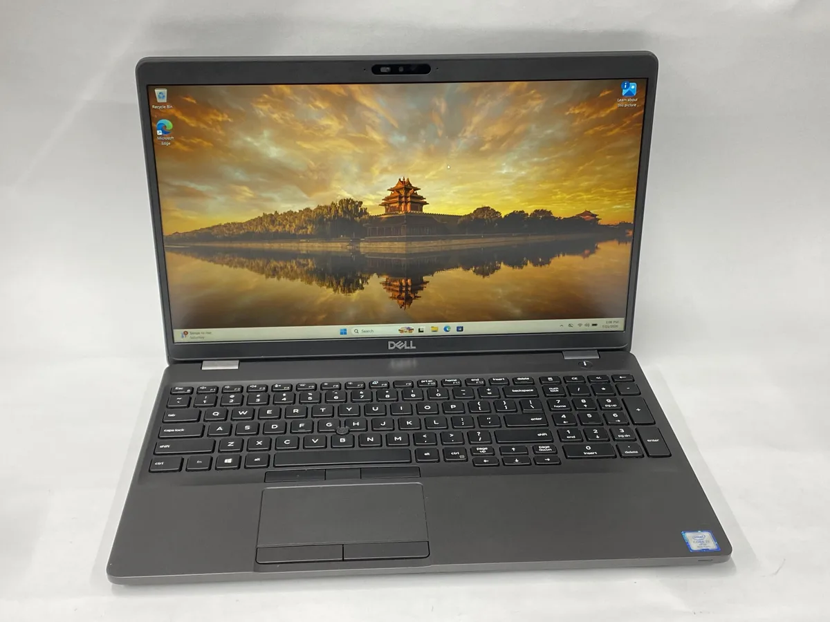Silver Dell Latitude 5500 laptop closed on white background