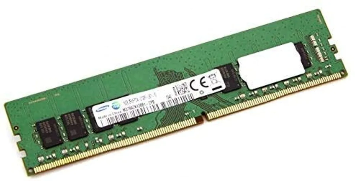 Green rectangular circuit board with black memory chips and gold edge connector