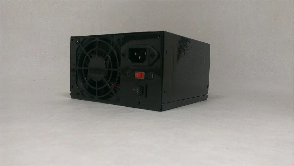 Grey ATX power supply unit with single fan and multiple cable connectors