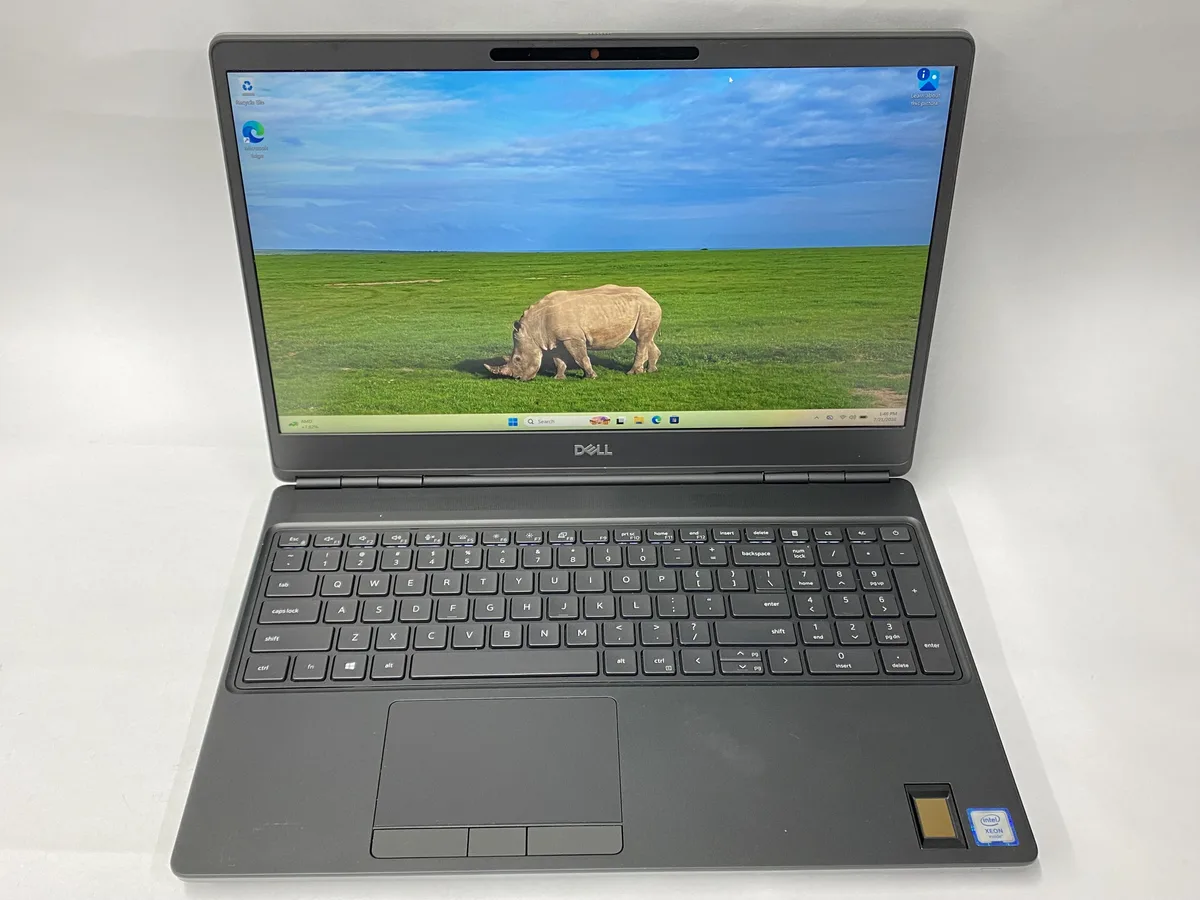 Silver Dell Precision 7560 laptop closed on a plain background