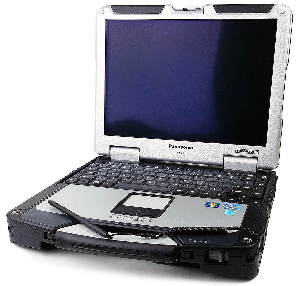 Rugged black laptop with 13.1 inch touchscreen and stylus, thick chassis, carry handle visible